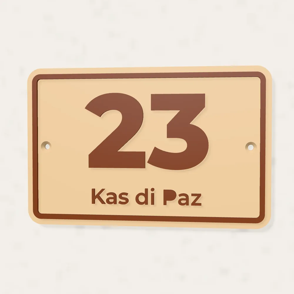 Sand and terracotta house number 23 plaque reading Kas di Paz